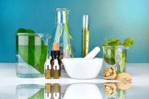 Natural organic medicine and healthcare, Alternative plant medicine, Mortar and herbal extraction in laboratory glassware.