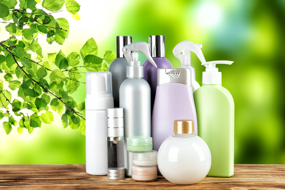 Set of body care products on green natural background